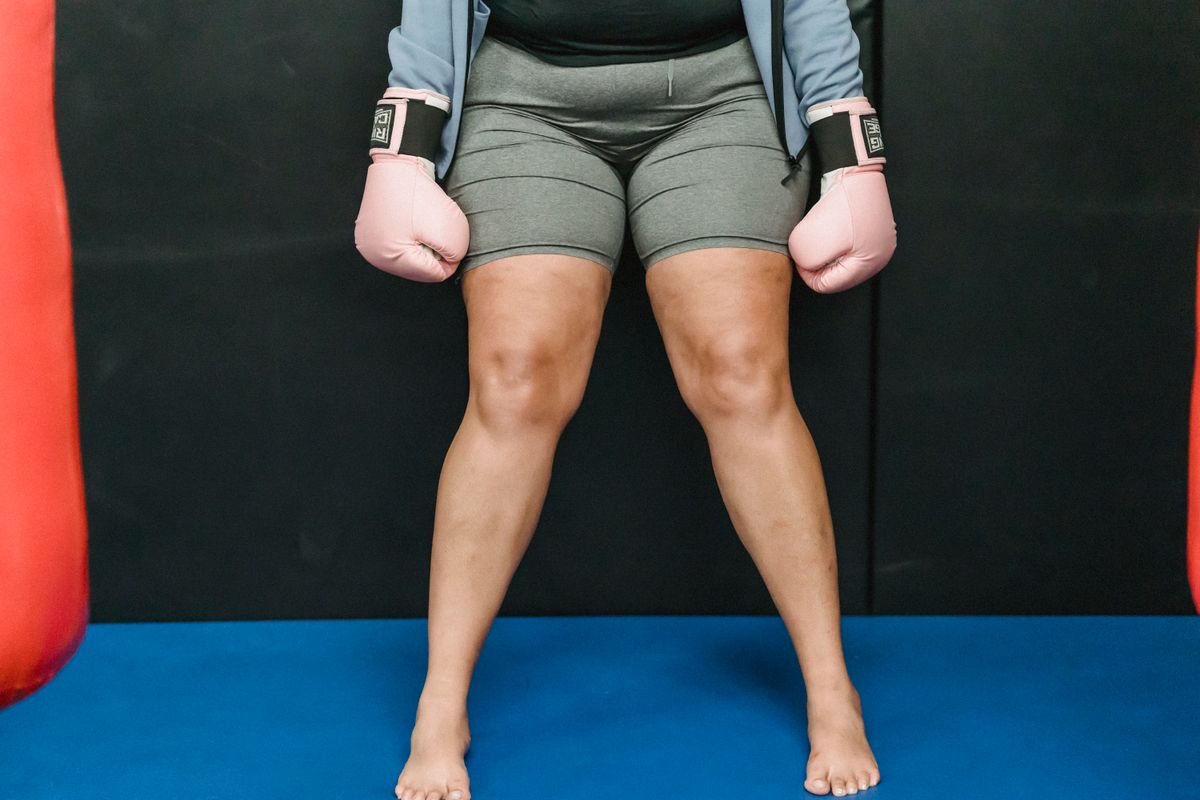 Person standing on a smart body composition scale at home
