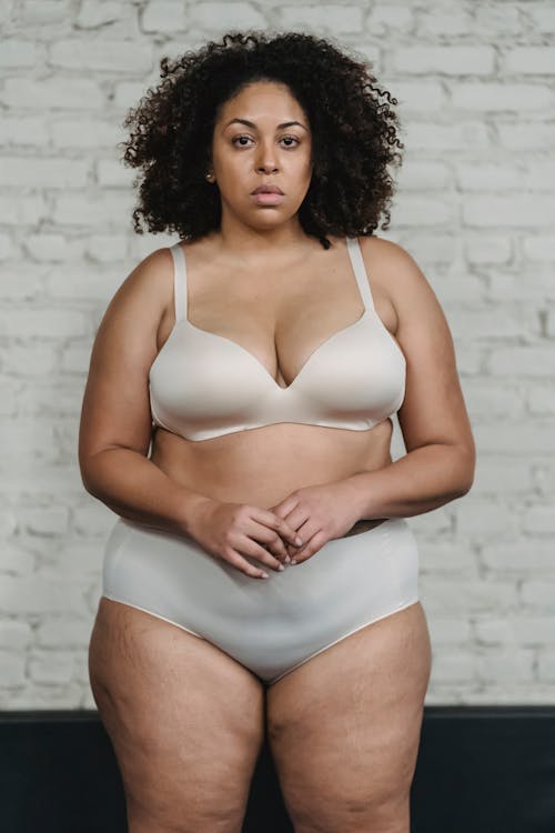 Serious plump black woman in underwear