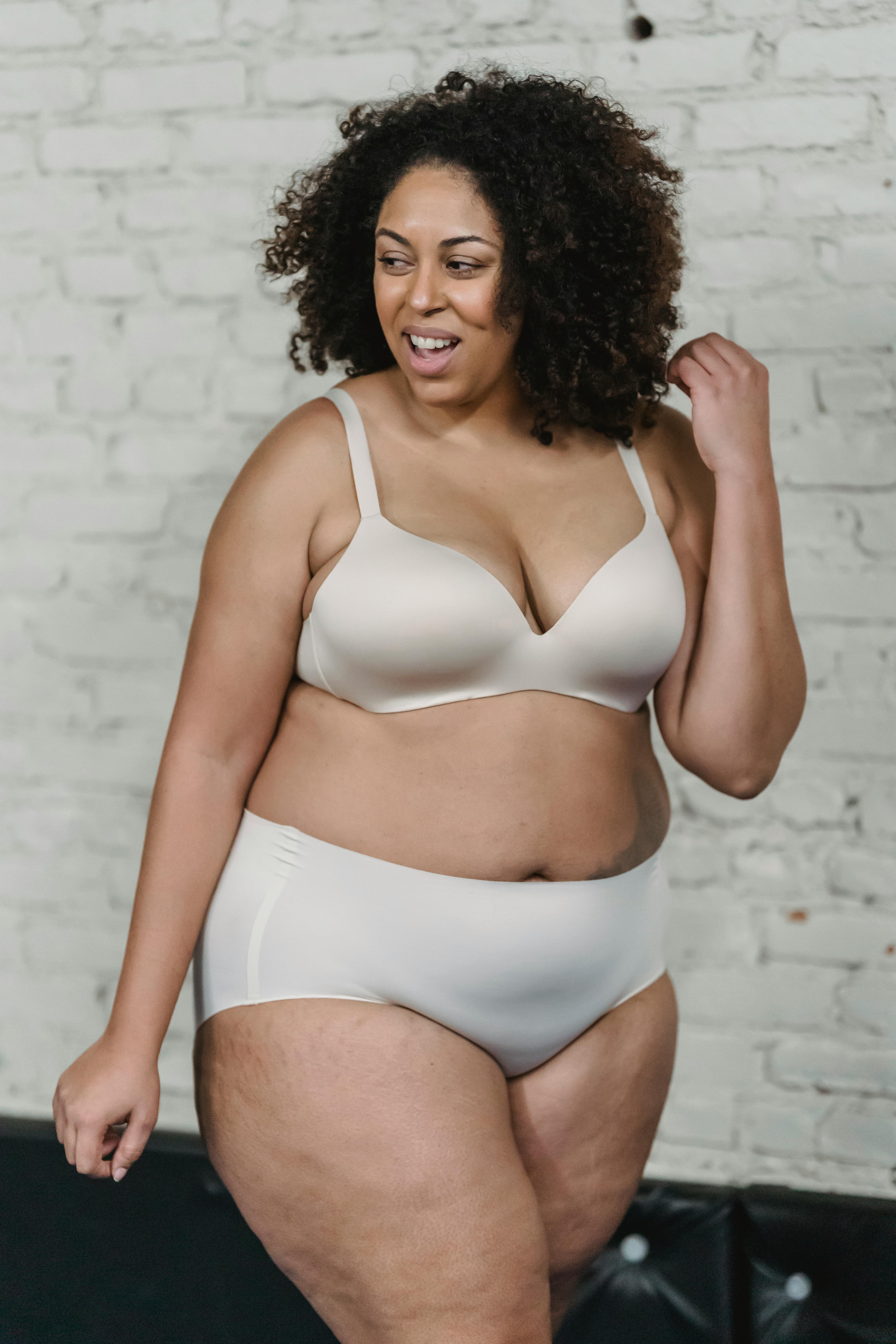 Overweight ethnic woman in lingerie in studio - a Royalty Free