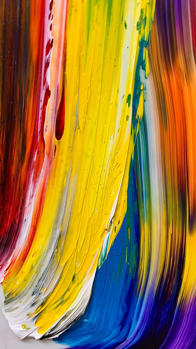 Streaks of fresh paint in red, yellow, green, and blue