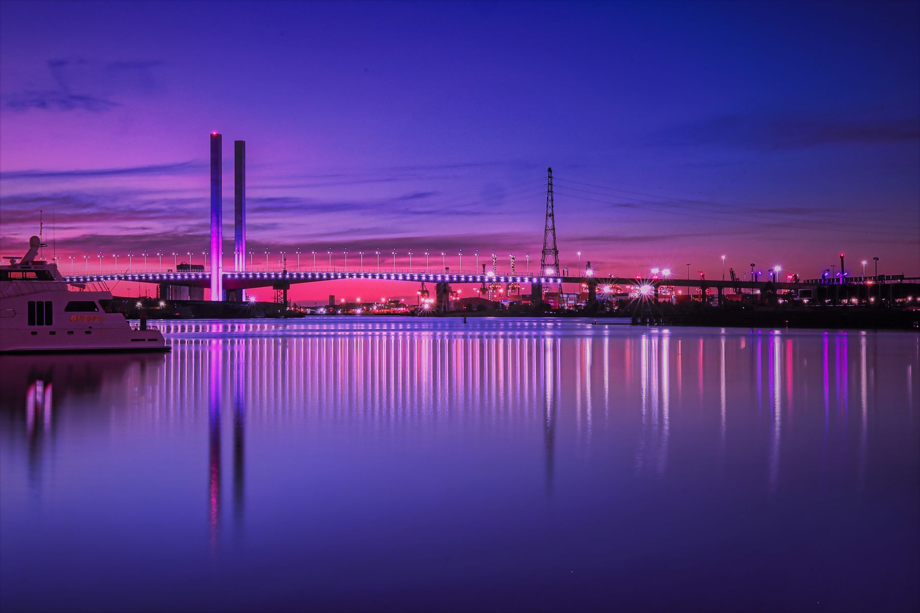 Beautiful twilight view of the iconic Bolte Bridge reflecting over the Yarra River in Melbourne, Australia.
