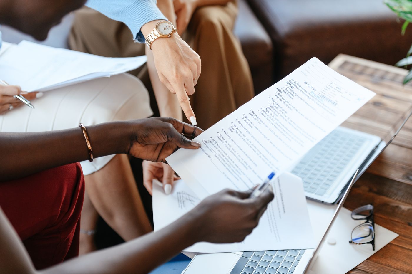Business professionals reviewing documents during a consultation