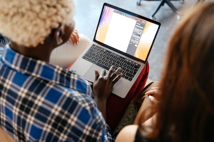 Diverse Women Communicating Online With Laptop