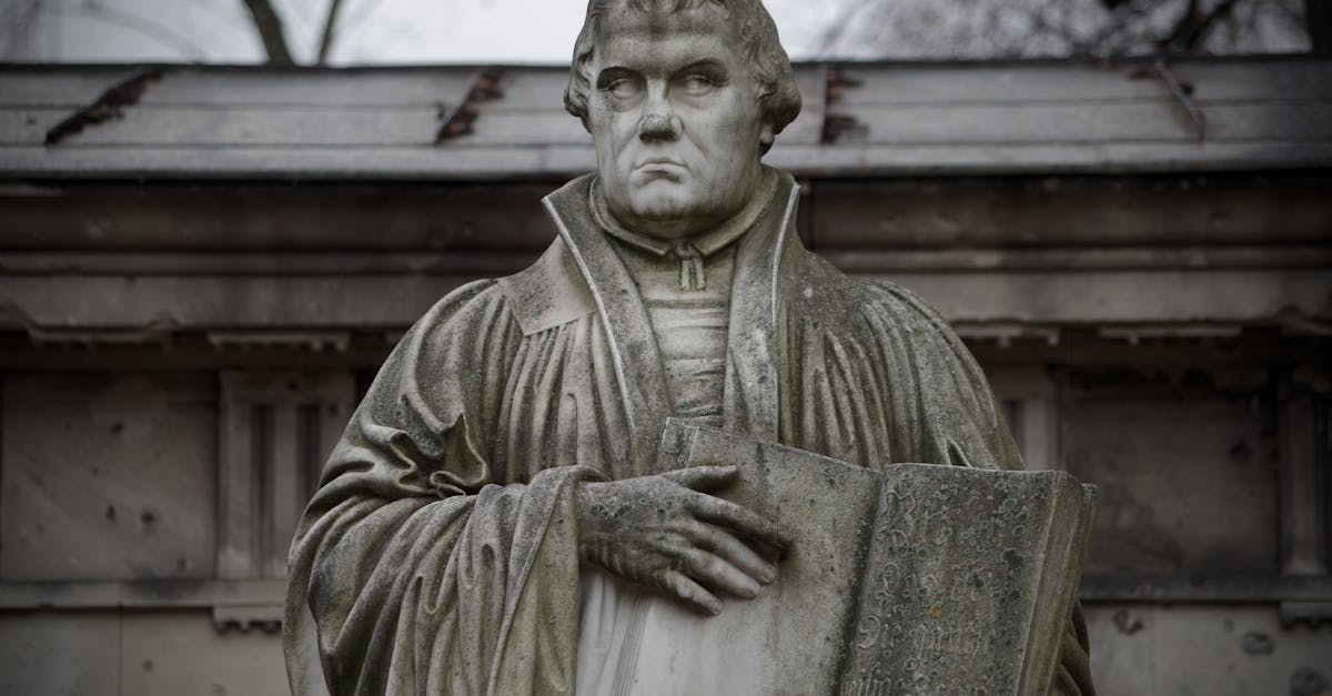 Close-up of the Martin Luther statue holding a book in Berlin, Germany.