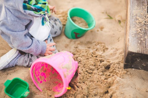 Free Little boy playing in the sand Stock Photo