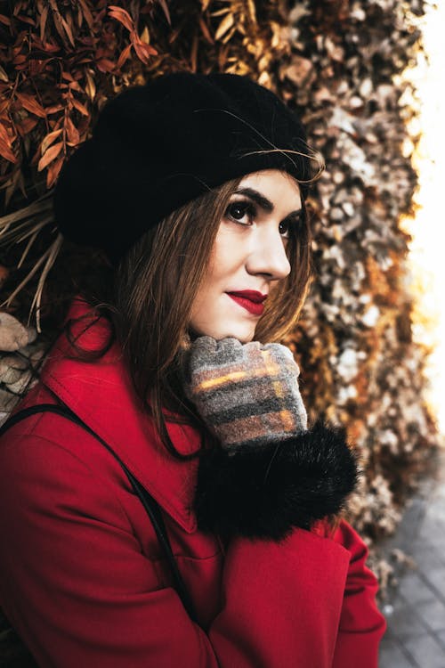 Pretty Woman in red Coat and Beret Hat