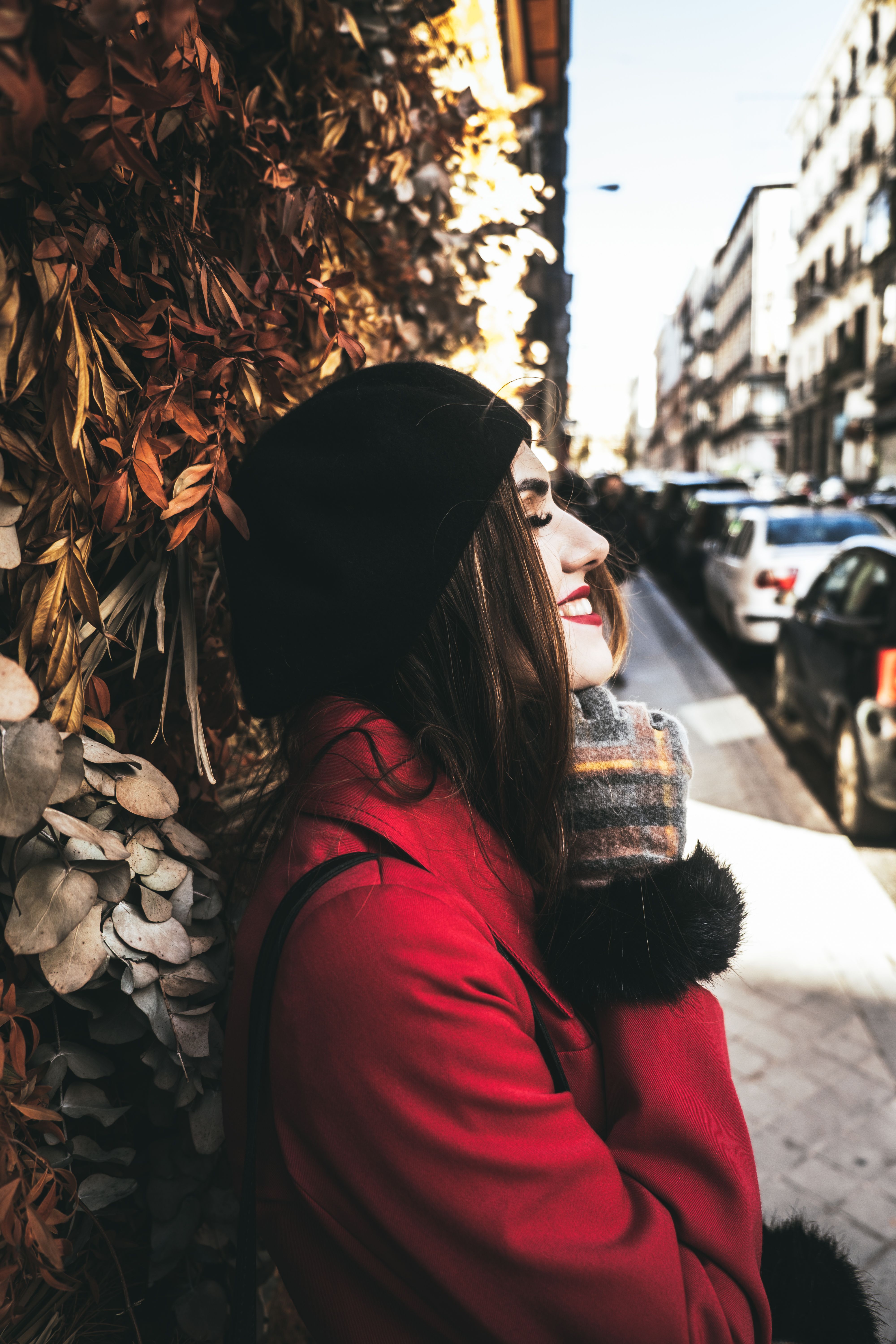 A Woman in Red Coat Standing on Street · Free Stock Photo