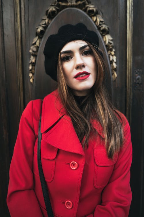 Woman in Red Coat Wearing Red Lipstick 