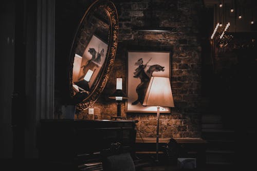 Free Vintage fashioned interior with aged piano and brick walls in dim light in evening Stock Photo