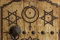 Religious symbols on wooden door