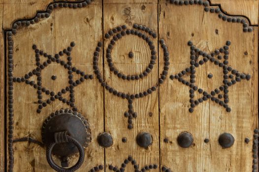 Religious symbols on wooden door