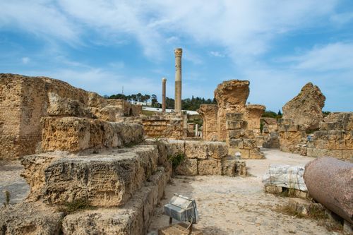 Free Ruins of aged destroyed stone constructions with rough surface and tower located in Tunisia city in Turkey against cloudy sky Stock Photo