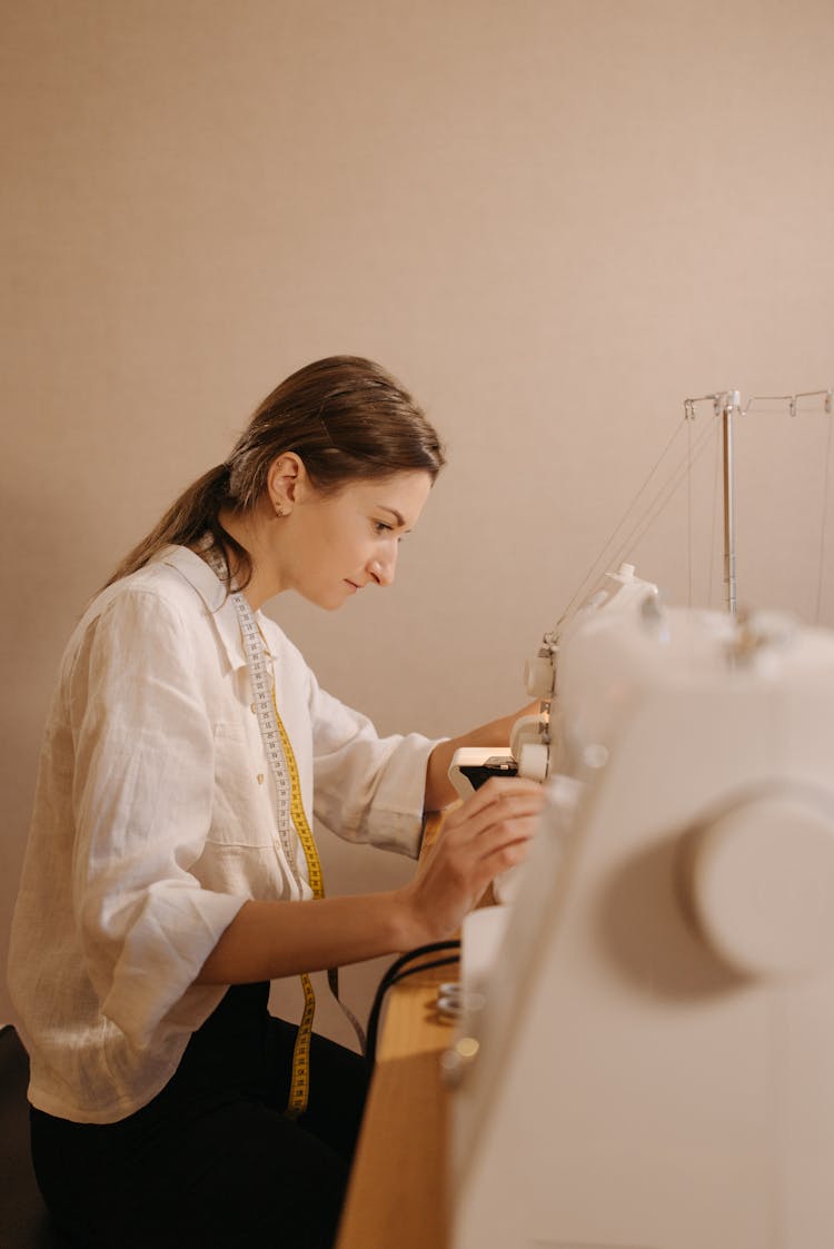 Woman Using A Sewing Machine