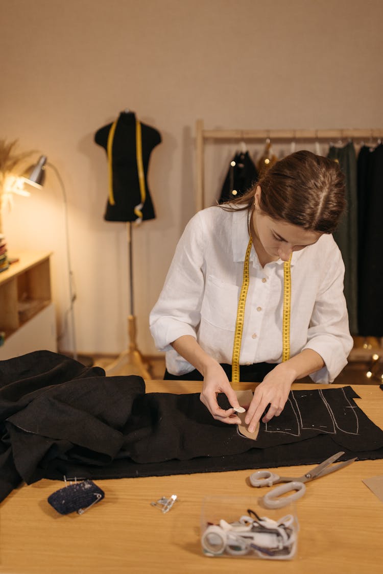 Woman Tracing On A Black Fabric