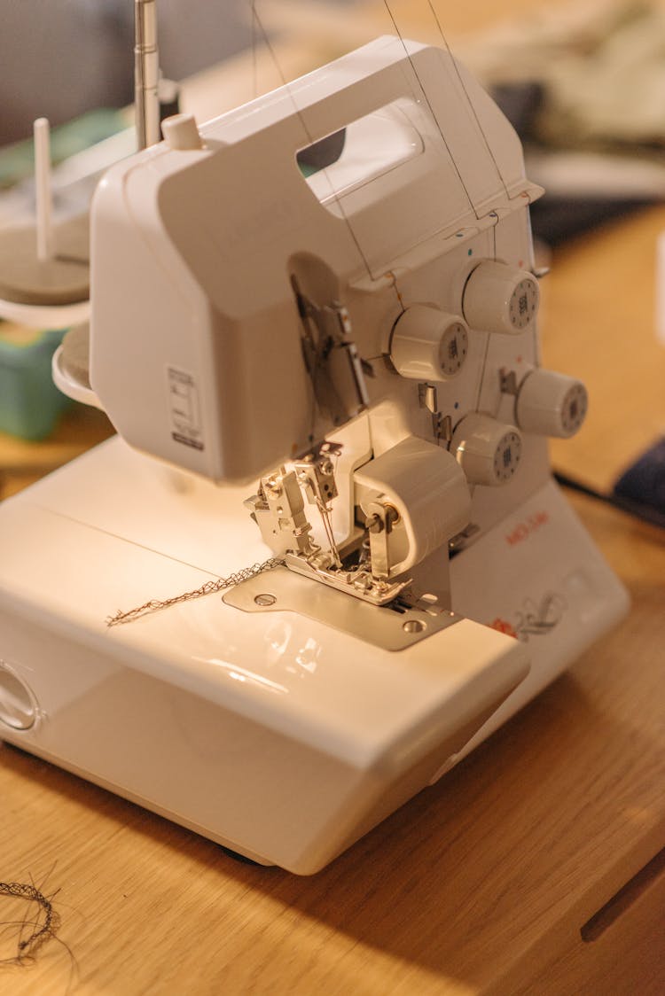 Close-Up Photo Of A White Sewing Machine