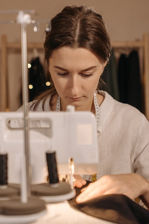 Dressmaker Sewing Fabric on Sewing Machine