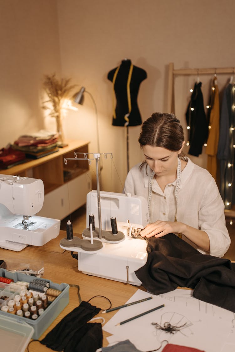 Dressmaker Sewing Fabric On Sewing Machine