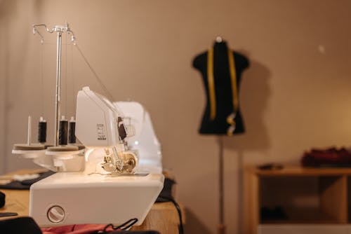 Sewing Machine on Wooden Table Photo