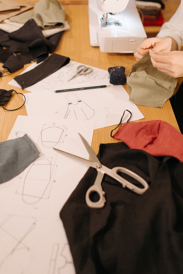 A Person Sewing And Making Cloth Face Mask