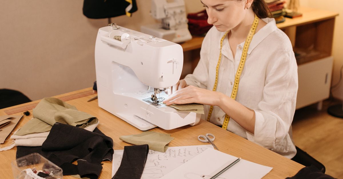 A Woman using Sewing Machine · Free Stock Photo