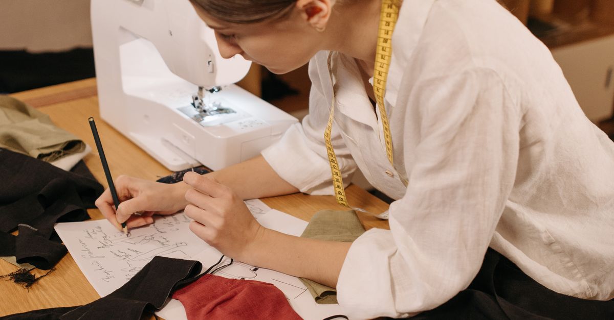 Pattern Dresmaker Dressmaker in White Long Sleeve Polo Shirt Sketching a Pattern on Paper ...