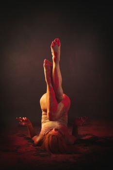 A Woman with Red Paint on Her Legs