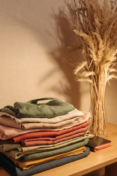 A Stack of Folded Clothes on the Table