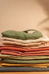 Stack of folded linen fabrics in earth tones — Pavel Danilyuk on Pexels