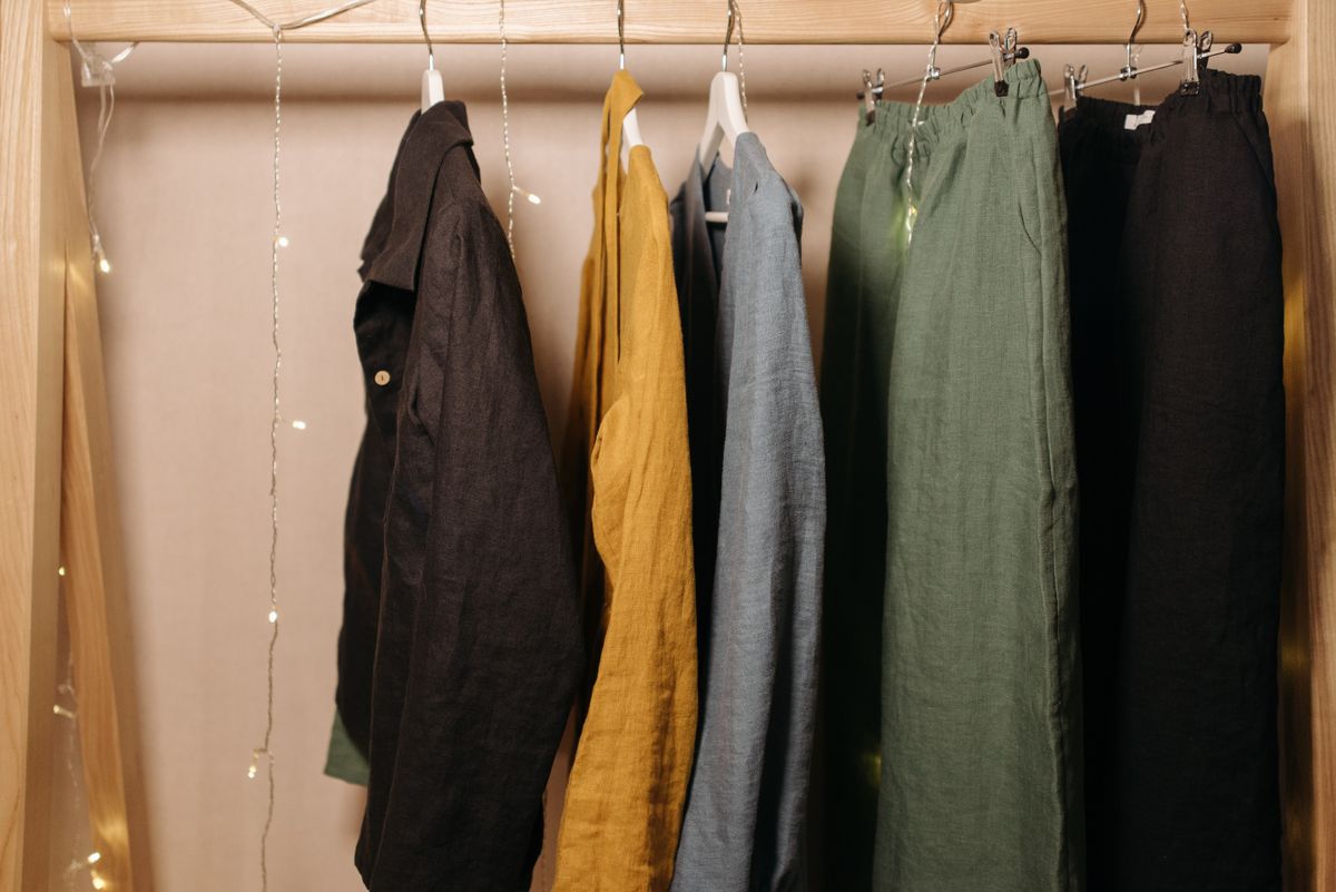 Linen garments hanging on a rail in warm daylight