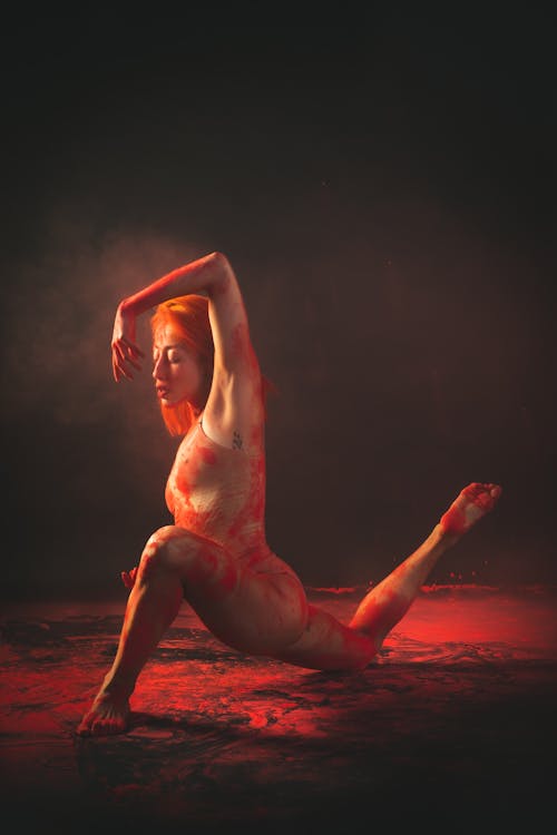 A Flexible Woman with Powder on Her Body