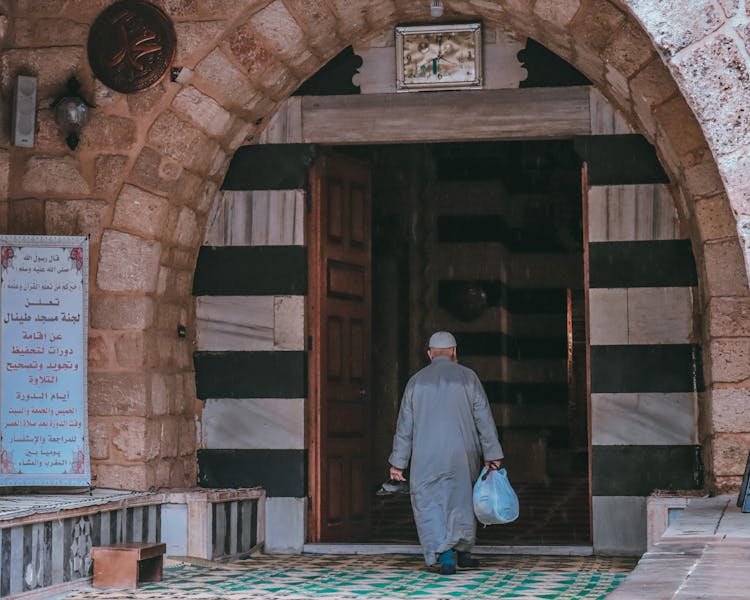 Man Walking To Mosque