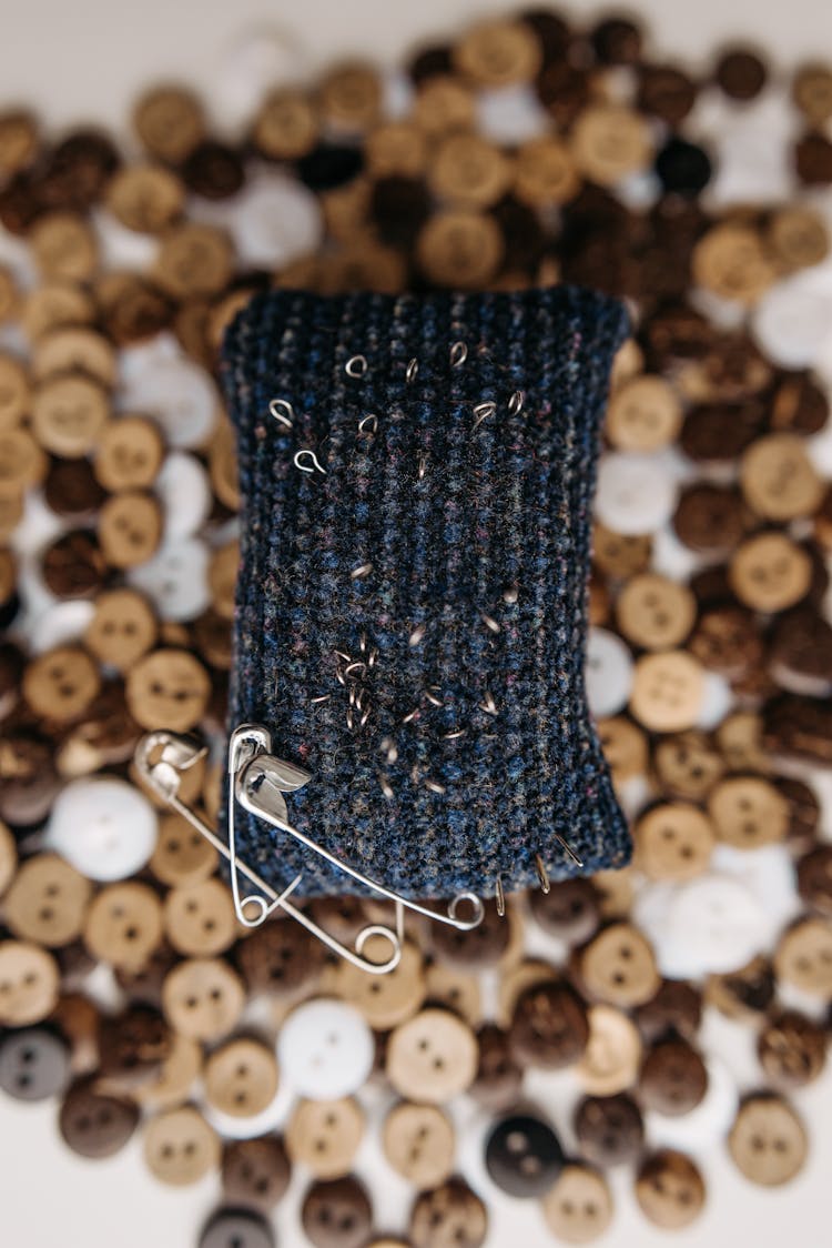 Safety Pins On Pin Cushion Close-Up Photo