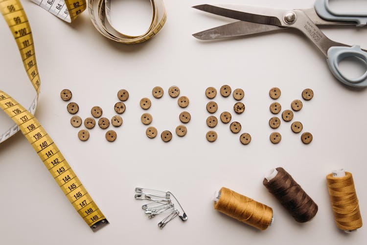 Flatlay Of Wooden Buttons Near Sewing Materials