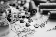 Grayscale Photo of Thread and Needle