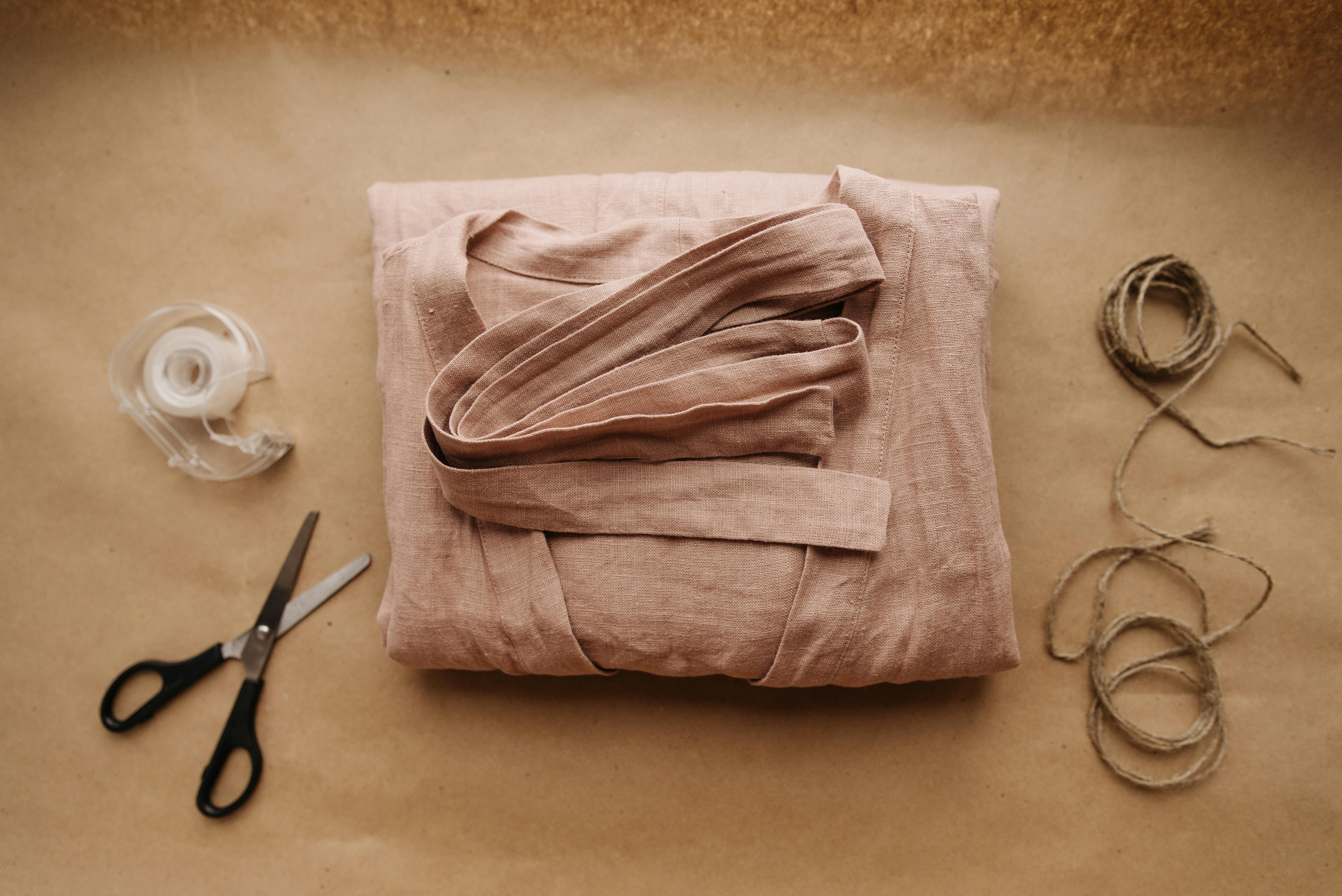 pink cloth on top of brown paper