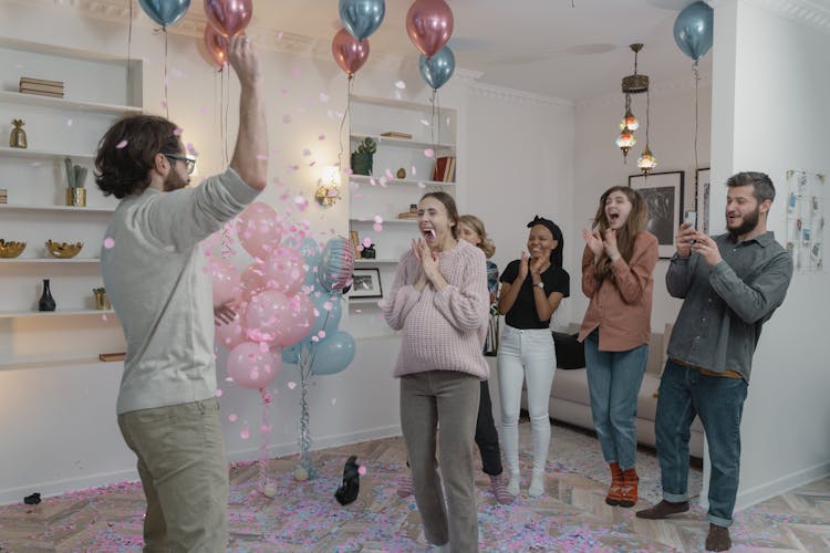 People Standing And Standing Near Balloons