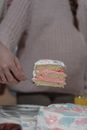 A Person Holding a Slice of Cake