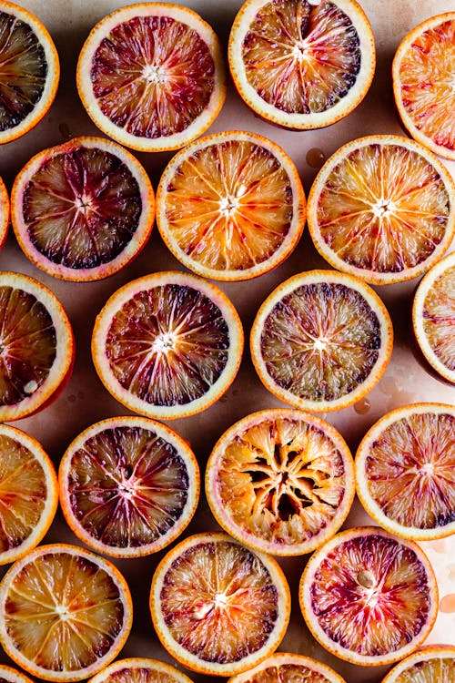 Sliced Orange Fruit on Black Surface