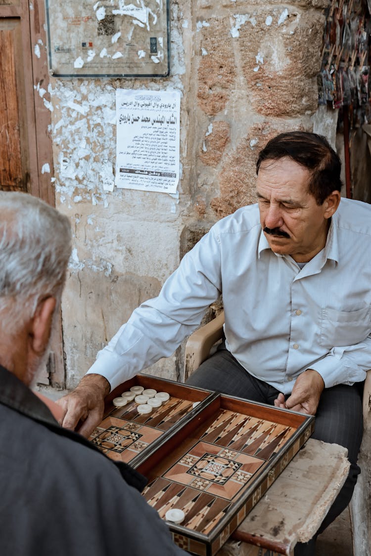 A Man Playing Backgammon