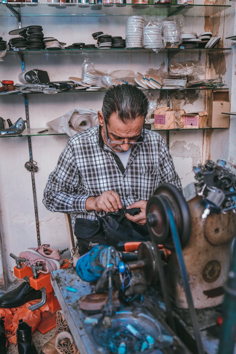 Shoemaker Working In His Workshop