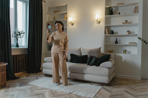Free A Woman Video Calling in a Living Room Stock Photo