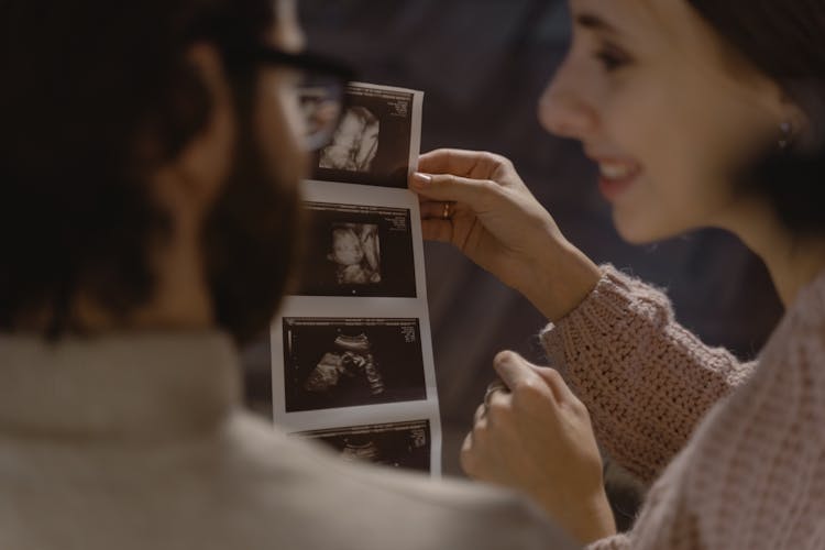 A Couple Looking At Ultrasound Picture