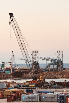 Cranes and shipping containers at Beirut's port showcasing industrial activity in Lebanon.