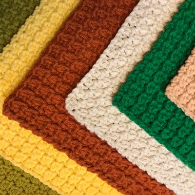 Stacked crochet blankets by Mara Cotta on Pexels