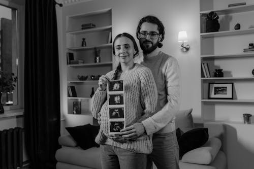 Free A Couple Holding Ultrasound Picture Stock Photo