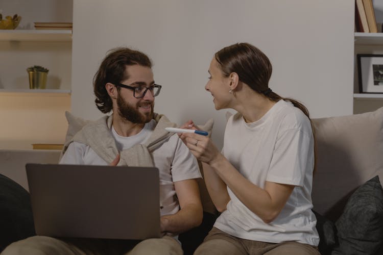 A Couple Happy About Positive Pregnancy Test