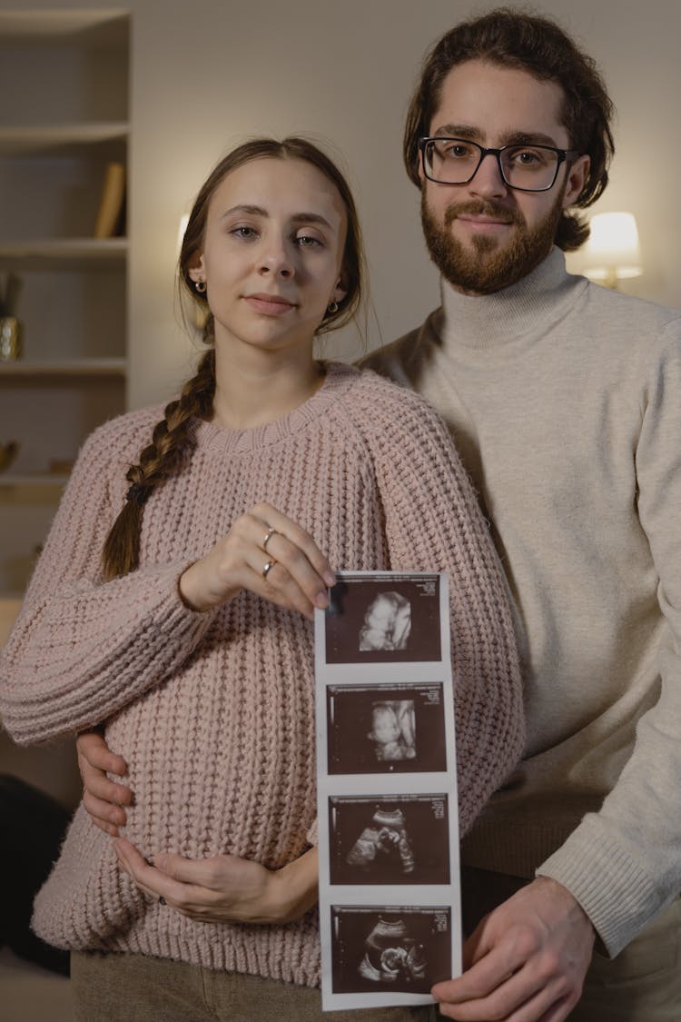 Portrait Of A Couple Holding An Ultrasound Picture