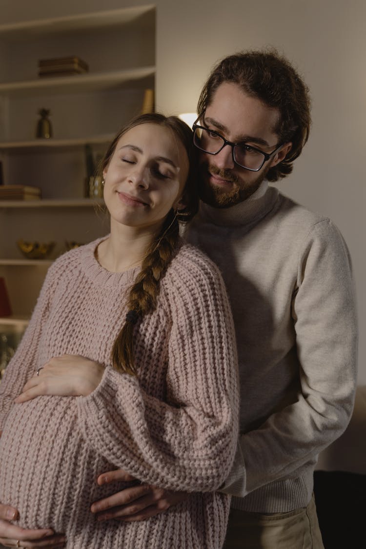 Husband Holding Tummy Of His Pregnant Wife