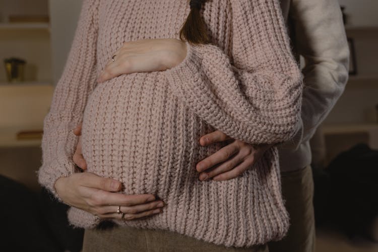 Husband Holding Tummy Of His Pregnant Wife