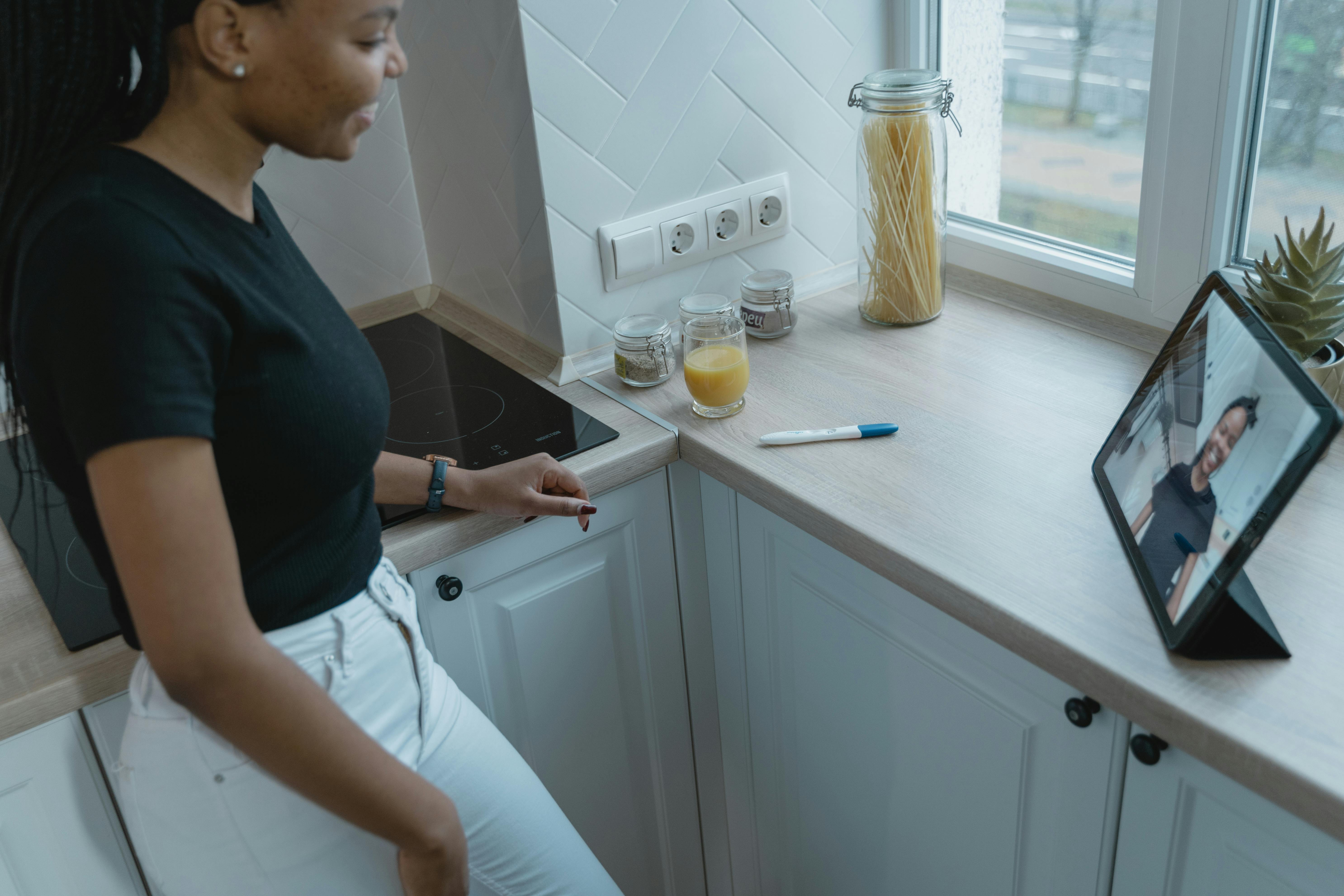 a woman in black top having a video call